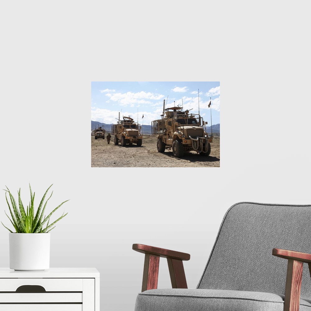 A modern room featuring May 12, 2012 - Three U.S. Army Mine Resistant Ambush Protected vehicles provide security during a...