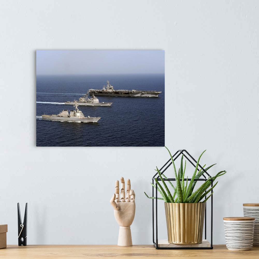 A bohemian room featuring Three U.S. Navy ships sail in formation in the Arabian Sea.