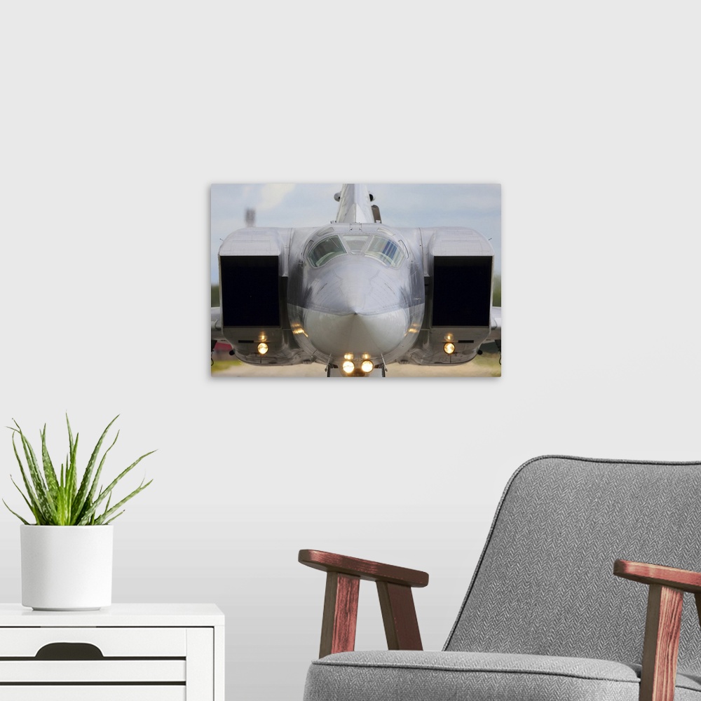 A modern room featuring Tupolev Tu-22M-3 strategic bomber of the Russian Air Force taxiing.