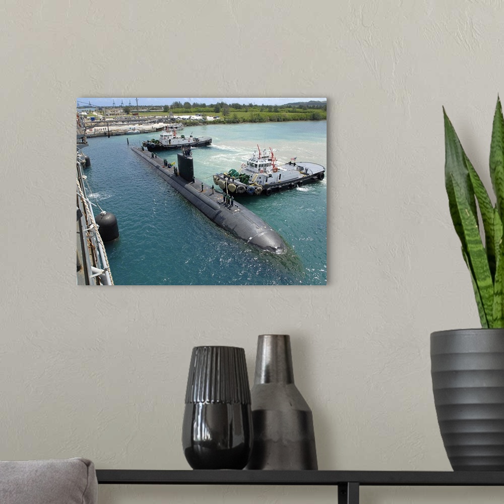 A modern room featuring Tugboats assist the Los Angeles-class attack submarine USS Topeka.