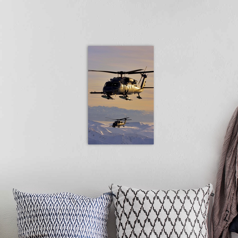 A bohemian room featuring Two Alaska Air National Guard HH-60G Pave Hawks in flight over Alaska