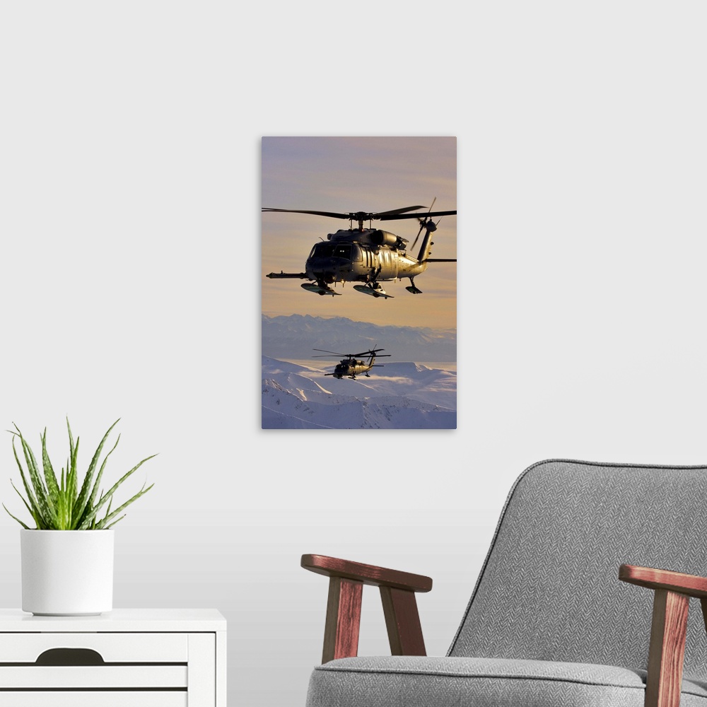 A modern room featuring Two Alaska Air National Guard HH-60G Pave Hawks in flight over Alaska
