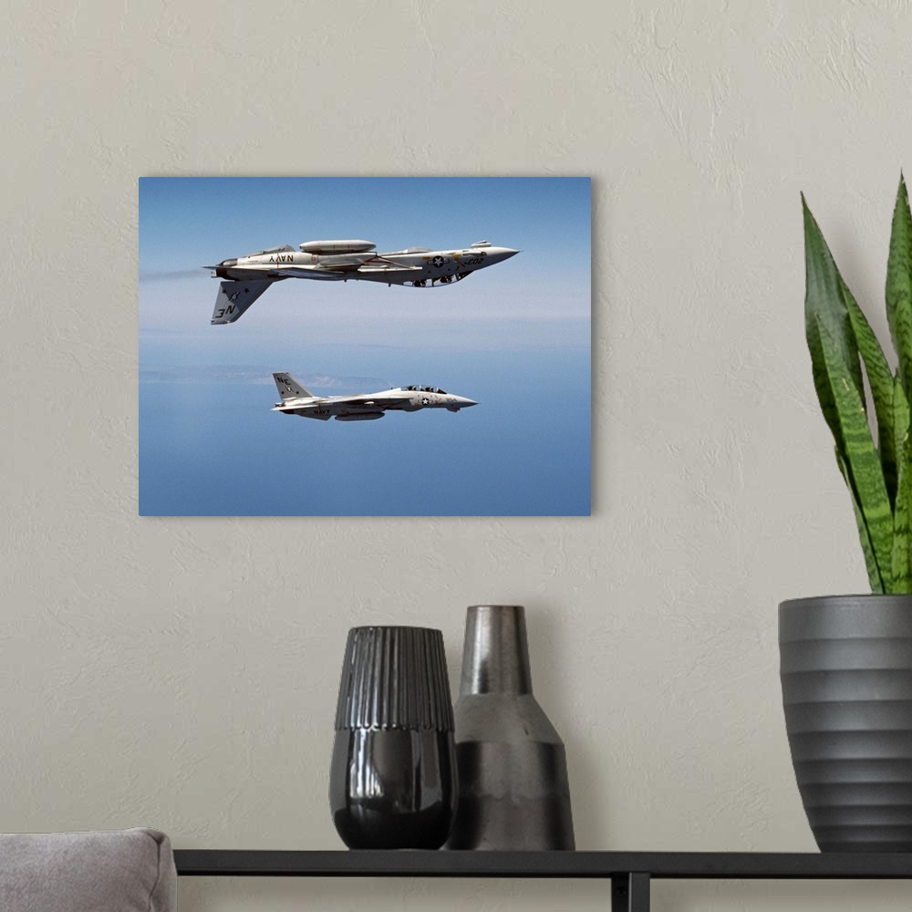 A modern room featuring Two F-14A Tomcats of U.S. Navy Fighter Squadron 2 (VF-2, the Bounty Hunters) perform aerobatics a...