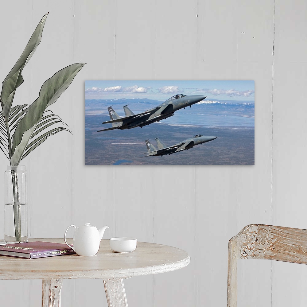 A farmhouse room featuring Two F-15 Eagles from the 173rd Fighter Wing conduct air-to-air training over Central Oregon.
