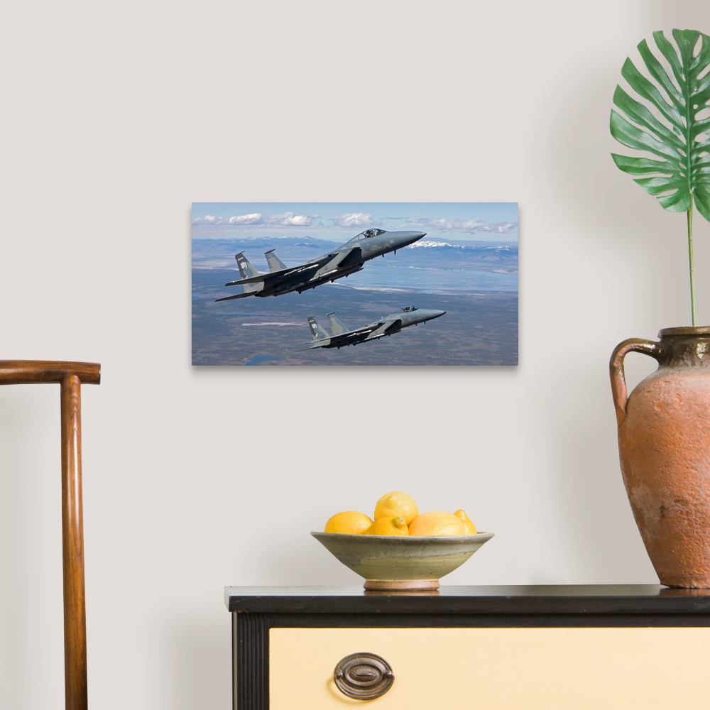 A traditional room featuring Two F-15 Eagles from the 173rd Fighter Wing conduct air-to-air training over Central Oregon.