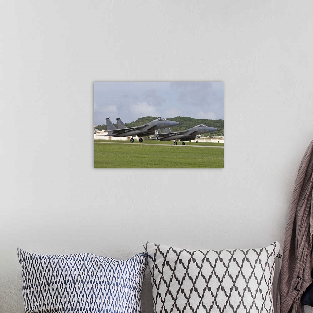 A bohemian room featuring Two F-15's from the 18th Wing take off in formation at Kadena Air Base, Okinawa, Japan.