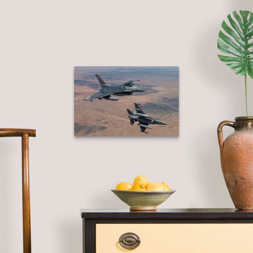 A traditional room featuring Two F-16's from the 56th Fighter Wing at Luke Air Force Base, Arizona, manuever on a training mis...