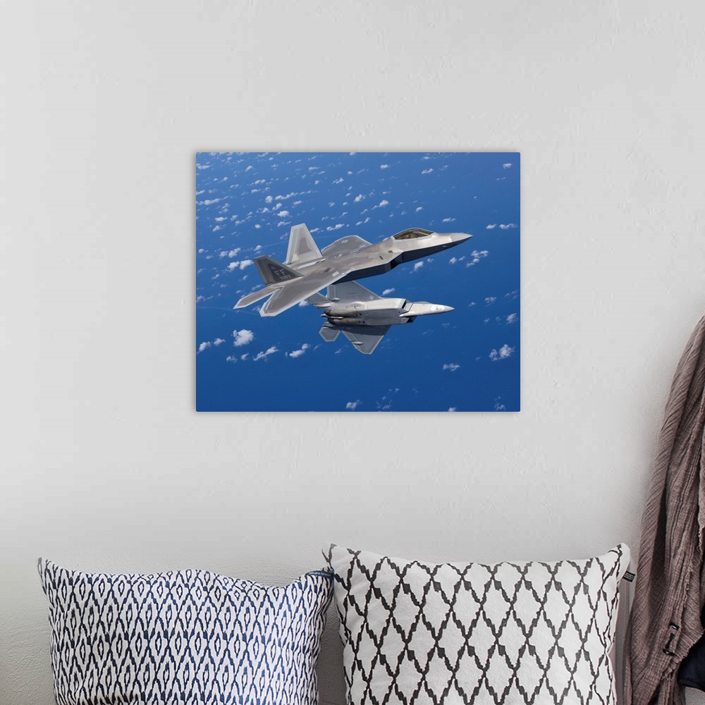 A bohemian room featuring Two F-22 Raptors from the 1st Fighter Wing at Langley Air Force Base, Virginia, maneuver while fl...