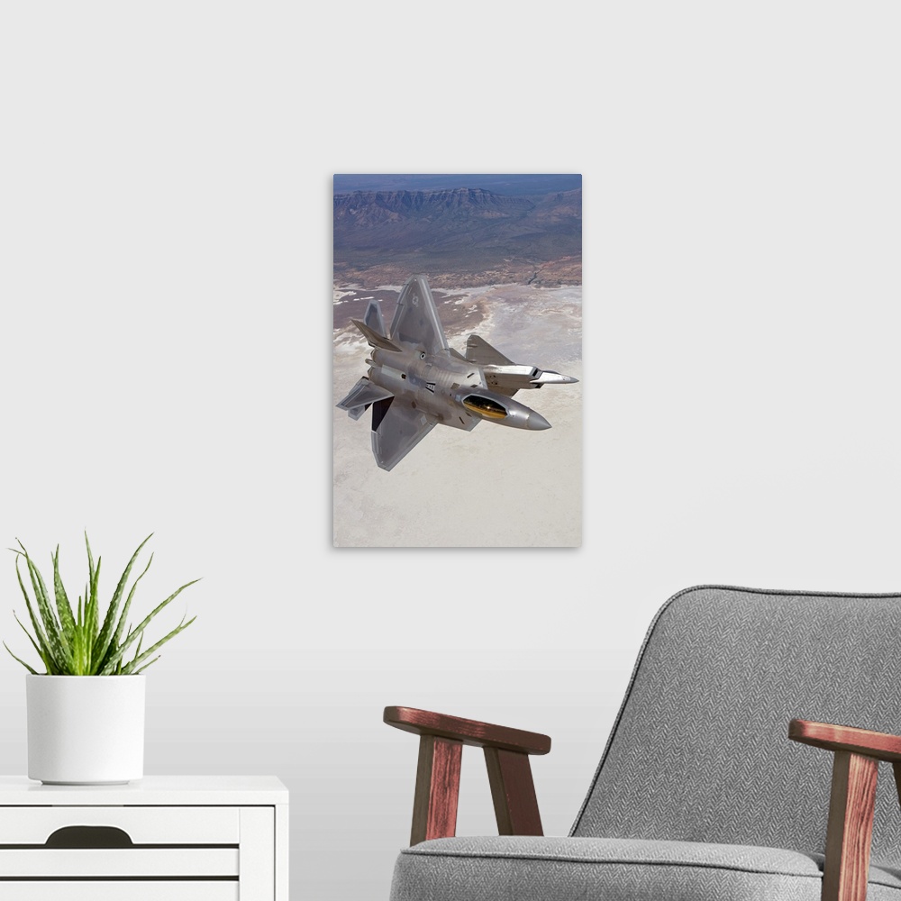 A modern room featuring Two F-22 Raptors from the 49th Fighter Wing manuever while on a training mission out of Holloman ...
