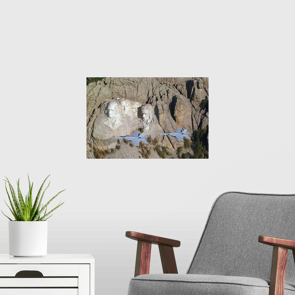 A modern room featuring Two military aircrafts are photographed flying by Mount Rushmore.