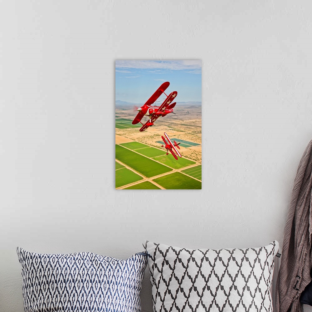 A bohemian room featuring Two Pitts Special S-2A aerobatic biplanes in flight near Chandler, Arizona.