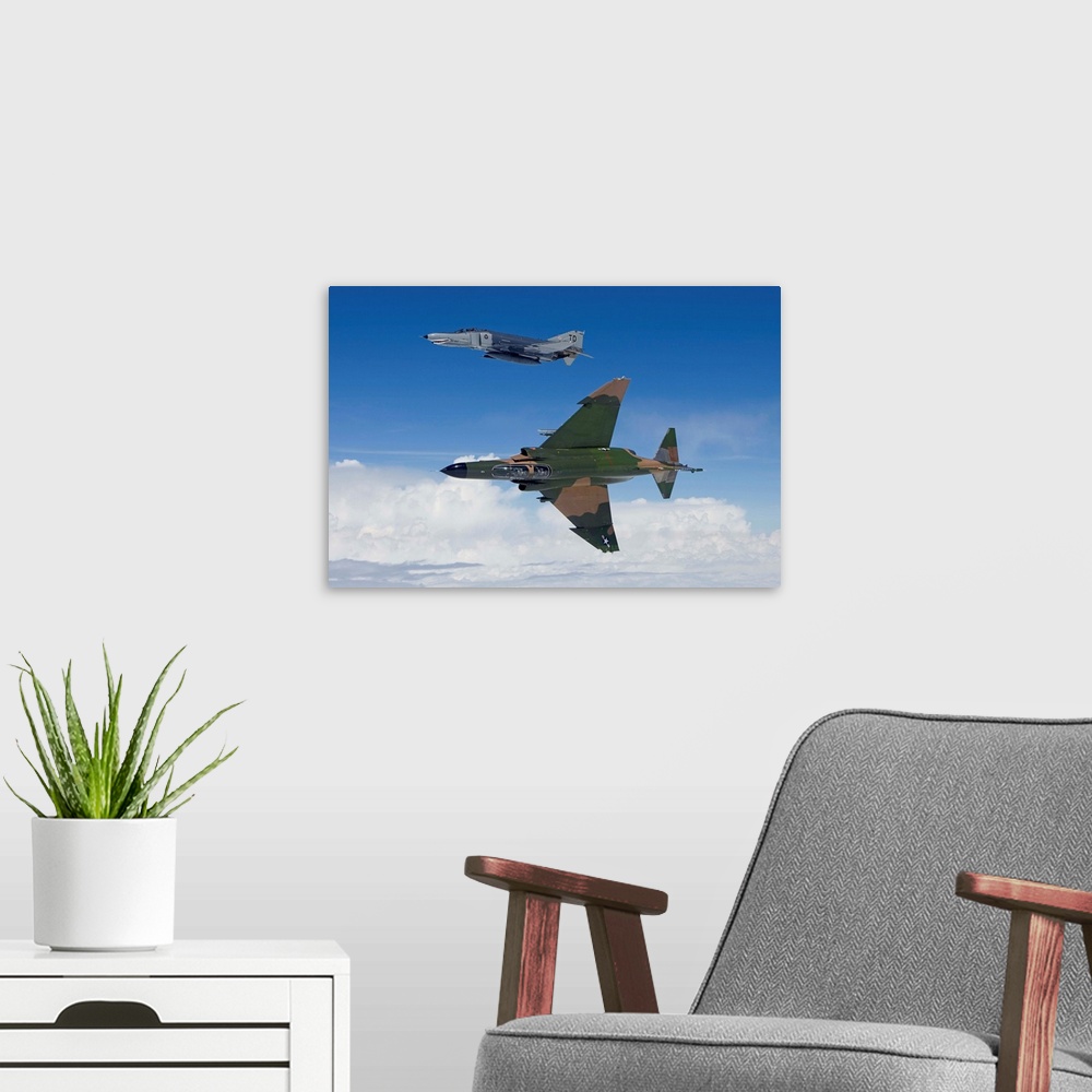A modern room featuring Two QF-4E's from the 82nd ATRS fly over the Gulf of Mexico during a training sortie out of Tyndal...