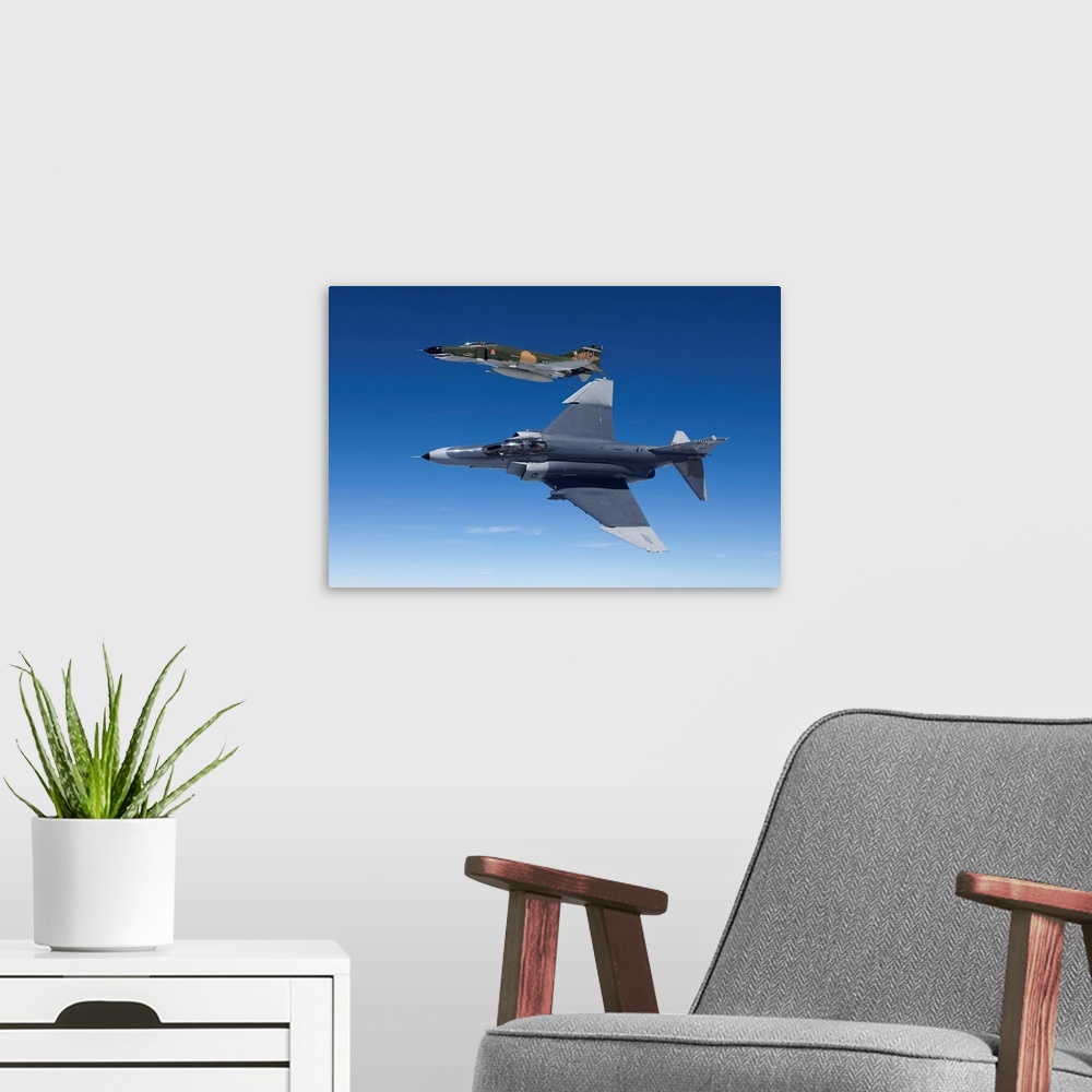 A modern room featuring Two QF-4E's from the 82nd ATRS fly over the Gulf of Mexico during a training sortie out of Tyndal...