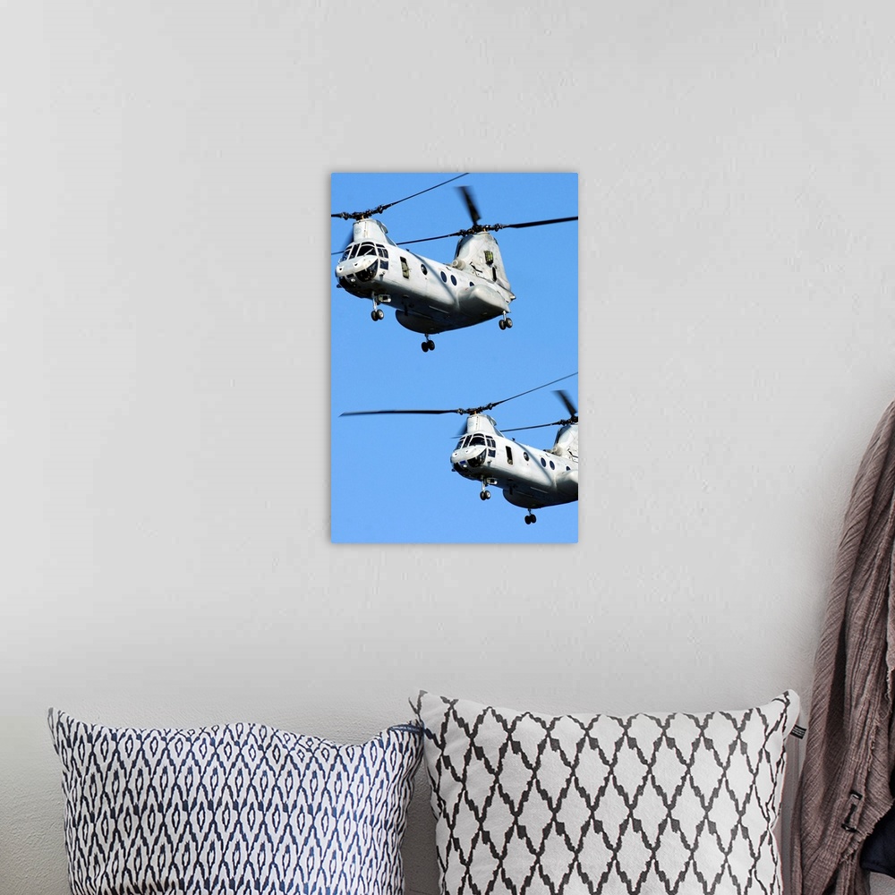 A bohemian room featuring November 9, 2010 - Two U.S. Marine Corps CH-46E Sea Knight helicopters fly near the amphibious as...