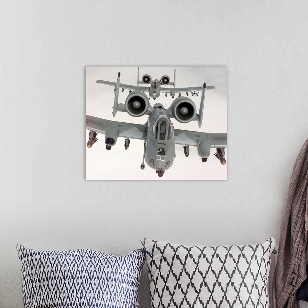 A bohemian room featuring Two US Air Force A10A Warthogs in flight