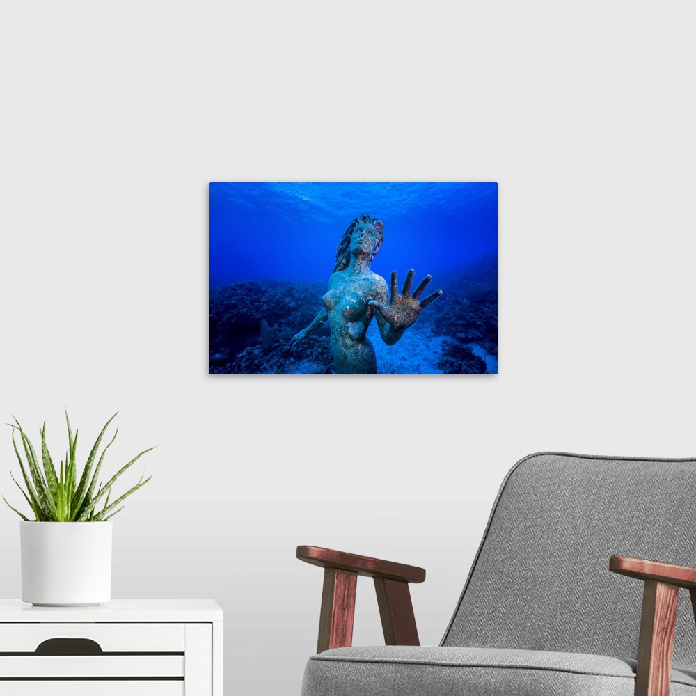A modern room featuring Underwater mermaid statue at Grand Cayman island.