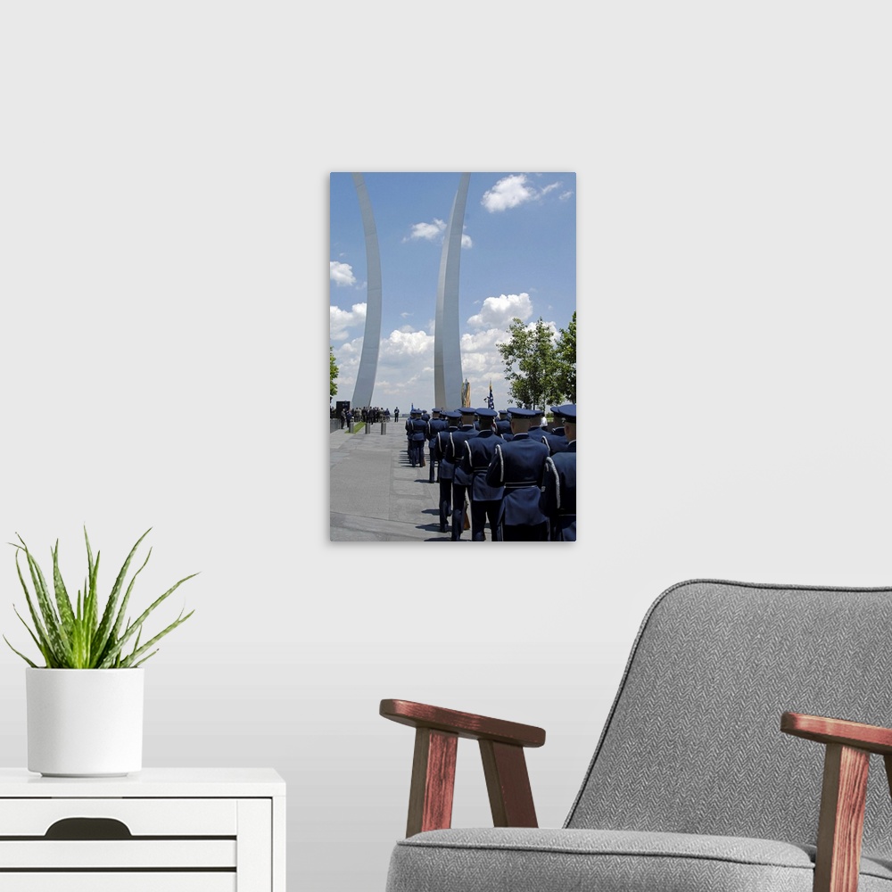 A modern room featuring United States Honor Guards stand in formation at the Air Force Memorial