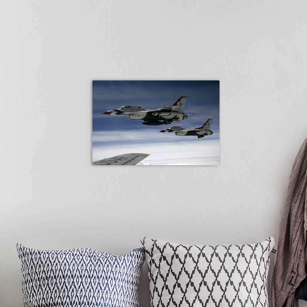 A bohemian room featuring U.S. Air Force F-16 aircraft fly off the wing of a KC-135 Stratotanker.
