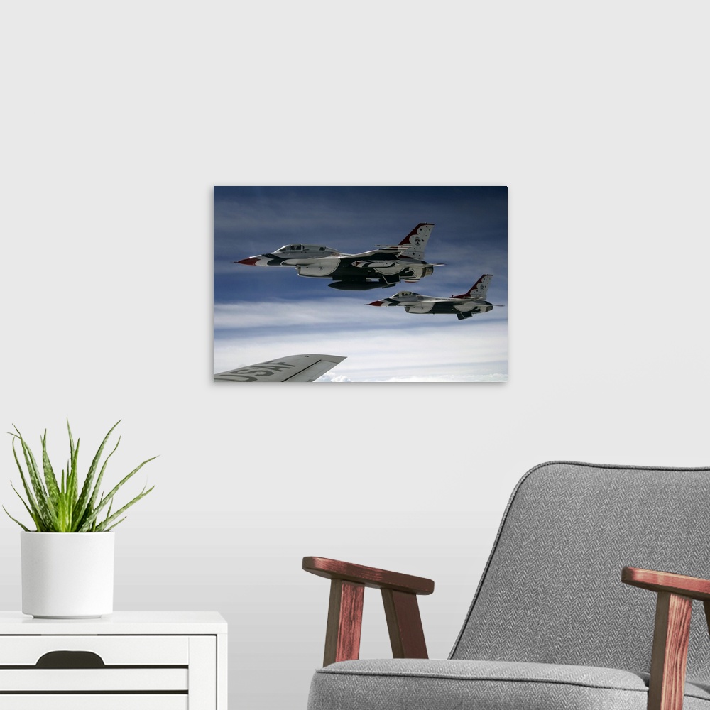 A modern room featuring U.S. Air Force F-16 aircraft fly off the wing of a KC-135 Stratotanker.