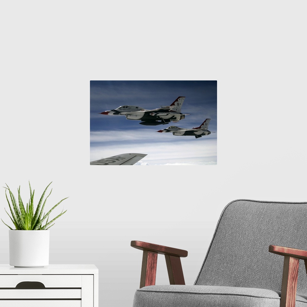 A modern room featuring U.S. Air Force F-16 aircraft fly off the wing of a KC-135 Stratotanker.