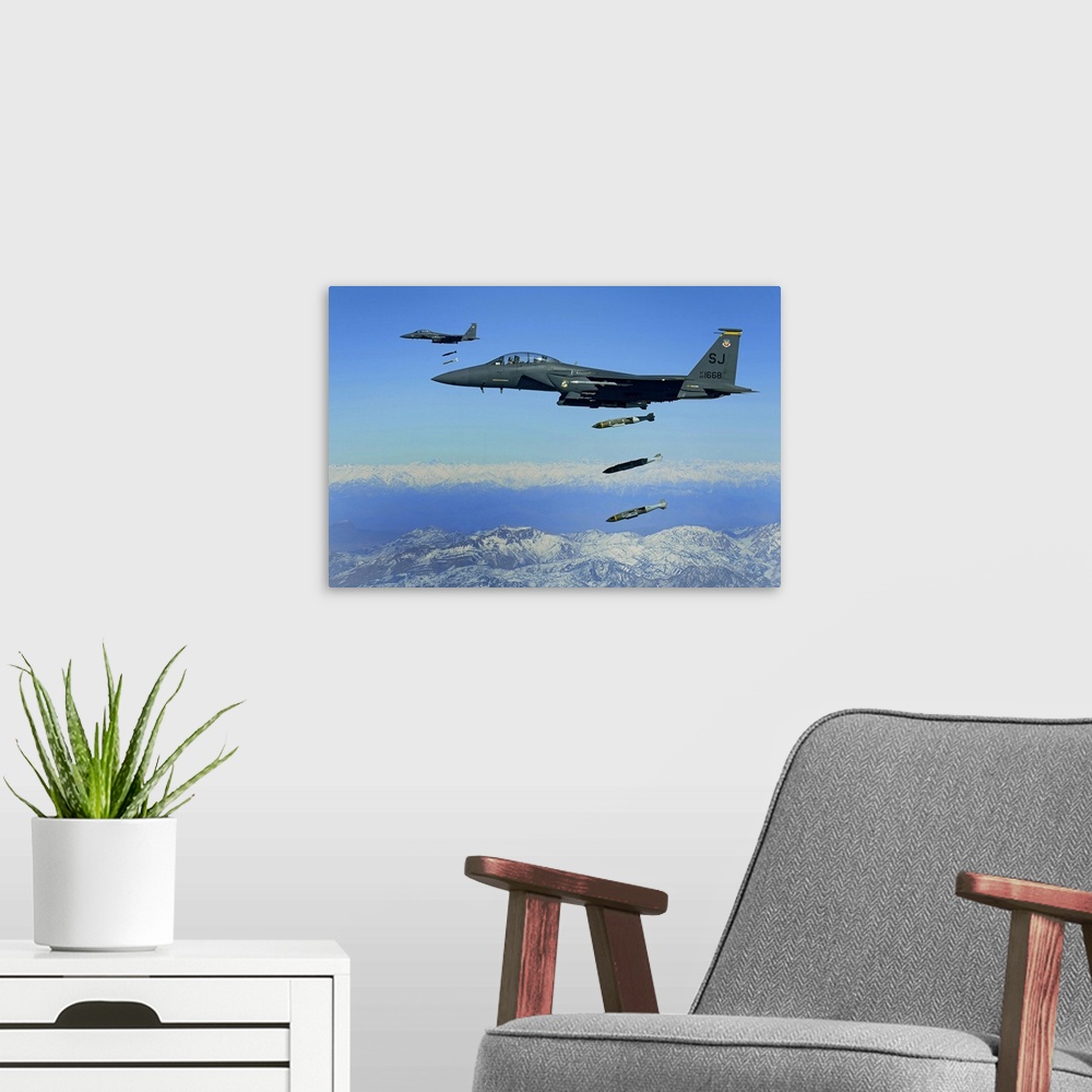 A modern room featuring US Air Force F15E Strike Eagle aircraft drops 2000pound joint direct attack munitions