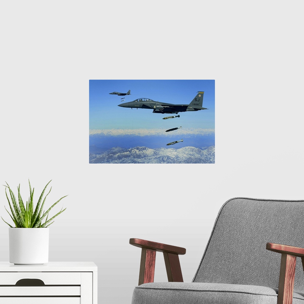 A modern room featuring US Air Force F15E Strike Eagle aircraft drops 2000pound joint direct attack munitions