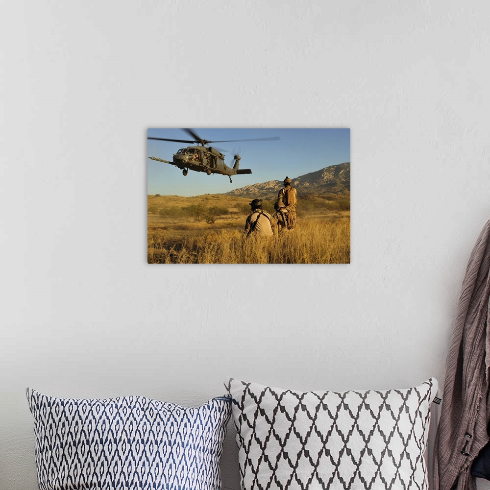 A bohemian room featuring October 18, 2011 - U.S. Air Force pararescuemen signal in a HH-60 Pave Hawk helicopter for extrac...