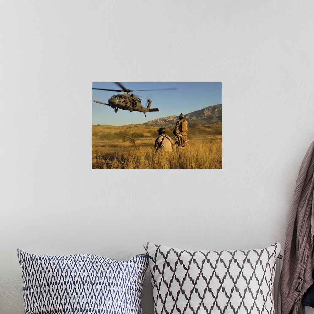 A bohemian room featuring October 18, 2011 - U.S. Air Force pararescuemen signal in a HH-60 Pave Hawk helicopter for extrac...