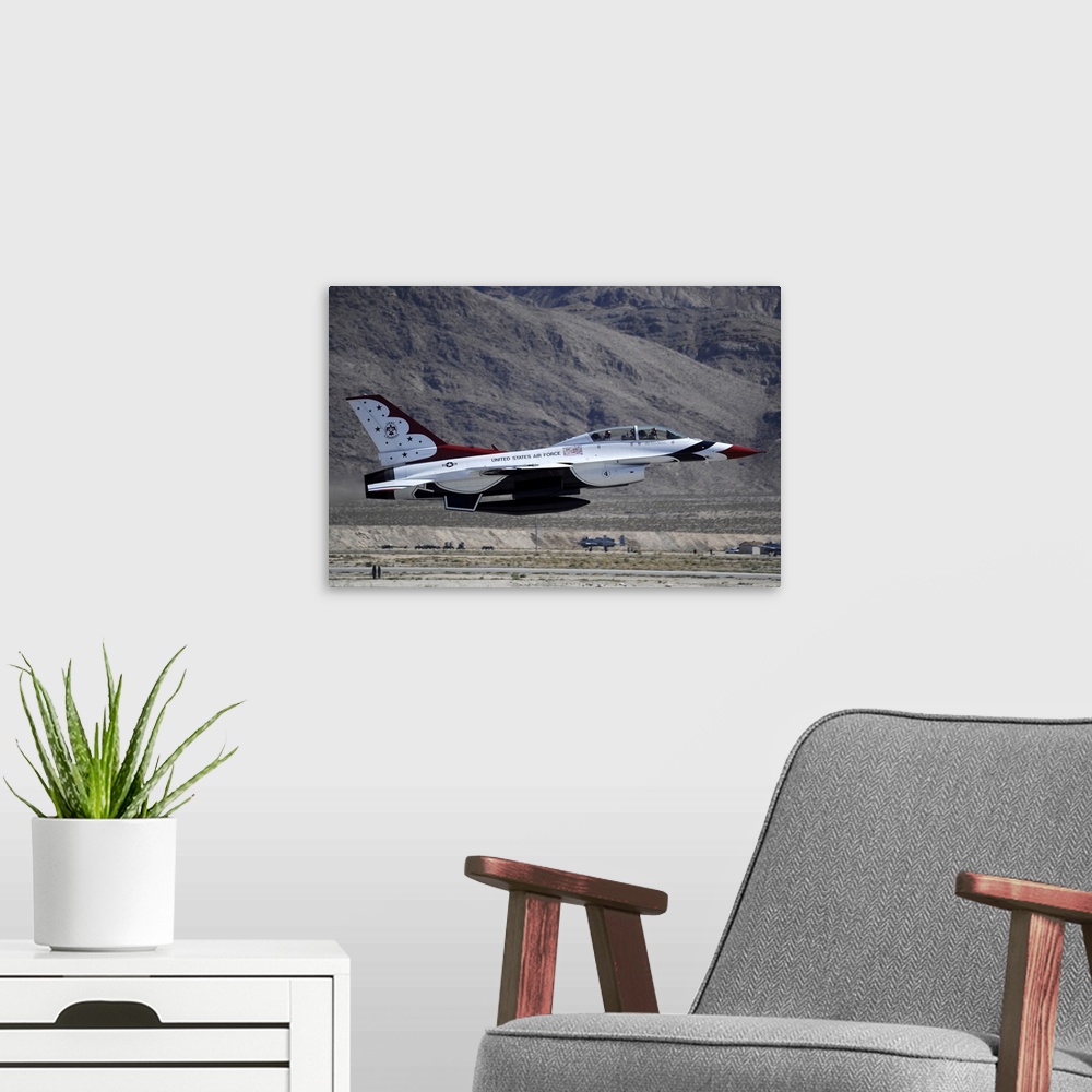 A modern room featuring October 11, 2011 - U.S. Air Force Thunderbird F-16 Fighting Falcon takes off at Nellis Air Force ...