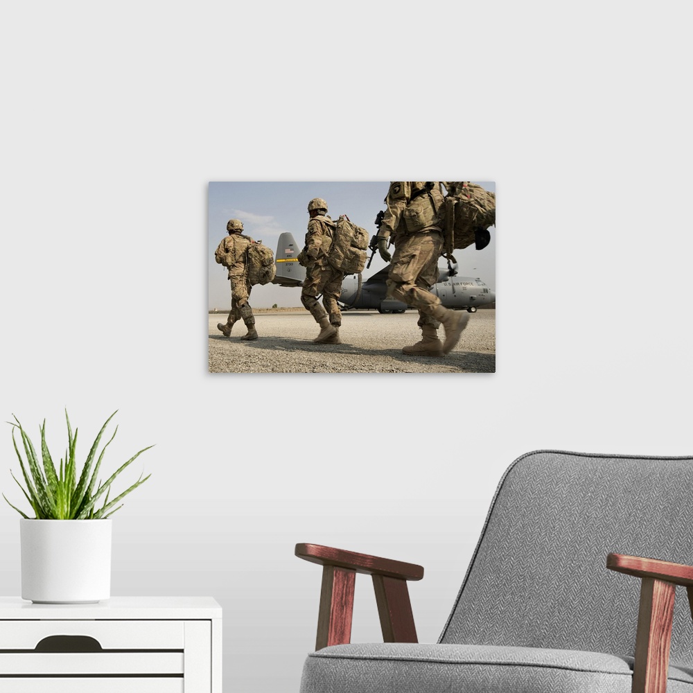 A modern room featuring September 23, 2013 - Army 101st Airborne Division Soldiers make their way to a 774th Expeditionar...