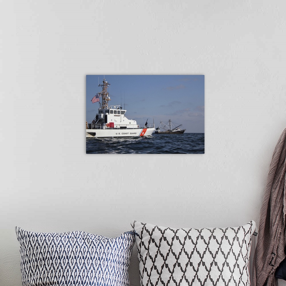 A bohemian room featuring June 21, 2010 - The U.S. Coast Guard Cutter Marlin patrols the waters south of Pensacola Bay to s...