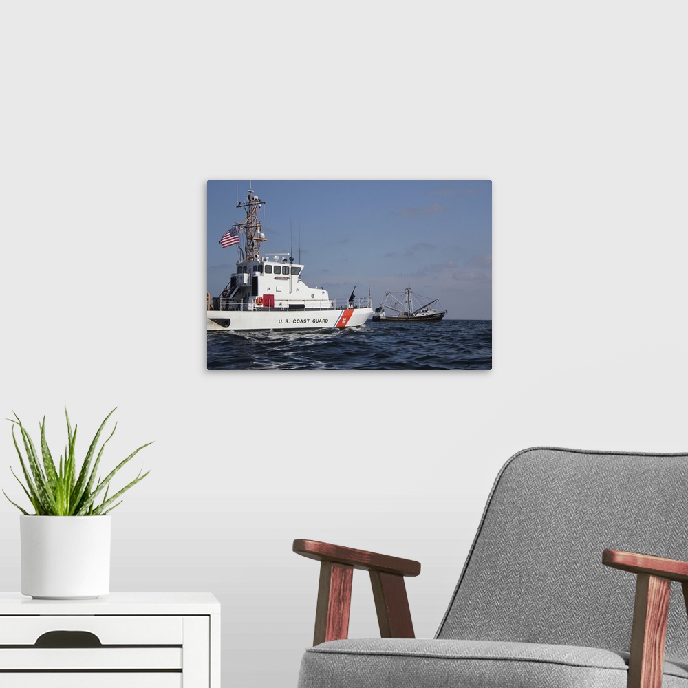 A modern room featuring June 21, 2010 - The U.S. Coast Guard Cutter Marlin patrols the waters south of Pensacola Bay to s...
