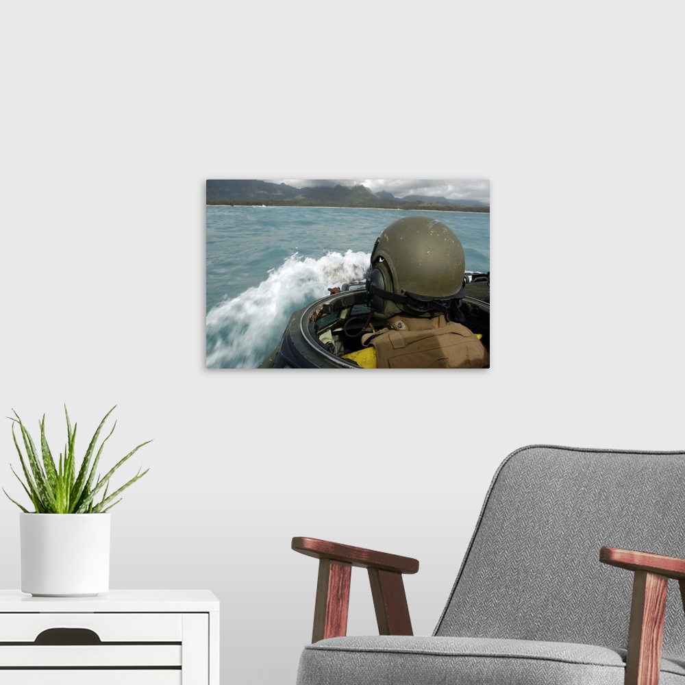 A modern room featuring US Marine driving an amphibious assault vehicle through the Pacific Ocean
