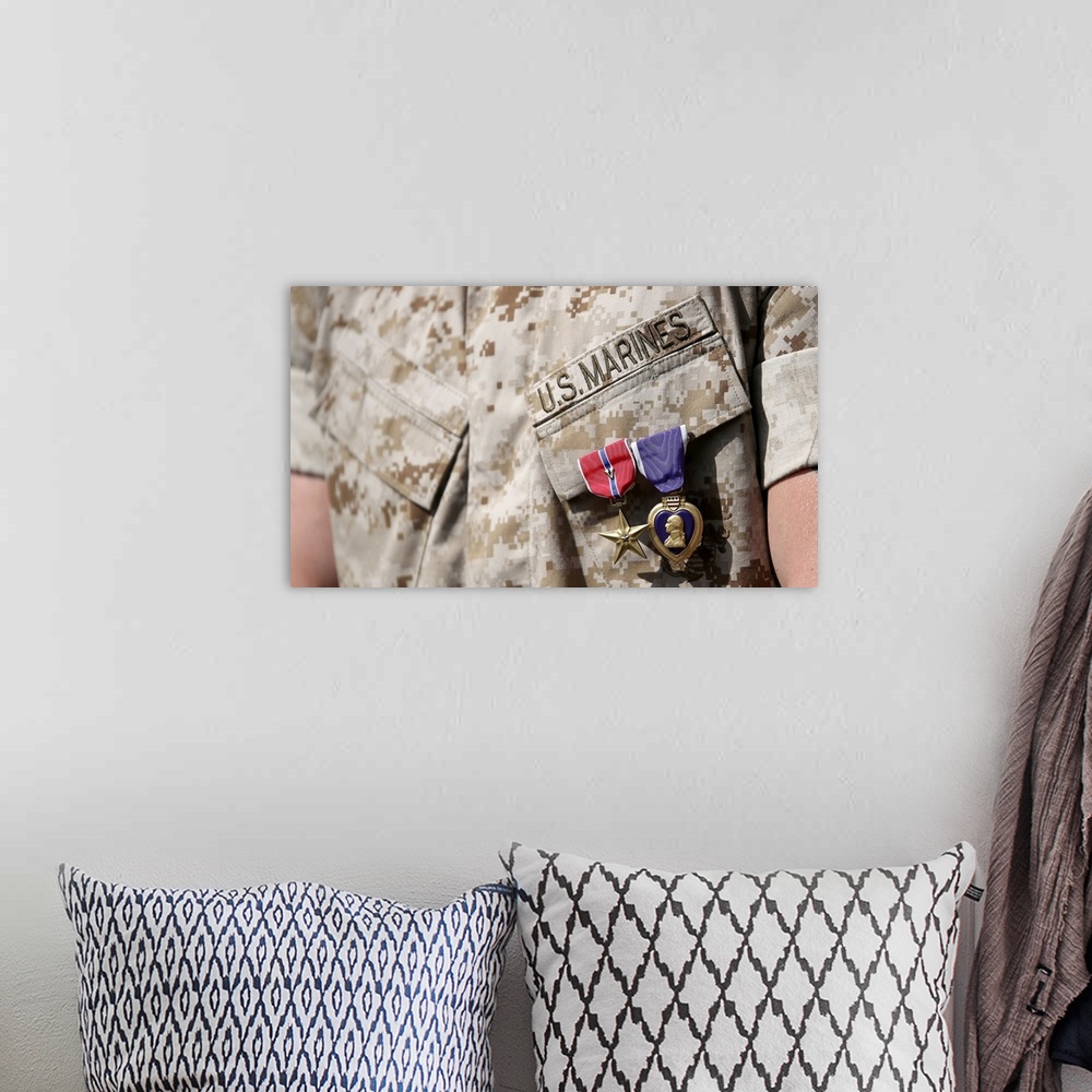 A bohemian room featuring U.S. Marine wears the Bronze Star Medal with combat distinguishing device and Purple Heart after ...