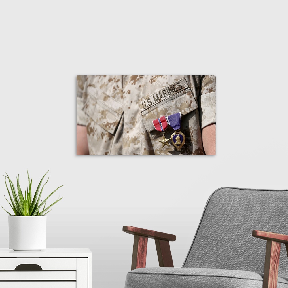 A modern room featuring U.S. Marine wears the Bronze Star Medal with combat distinguishing device and Purple Heart after ...