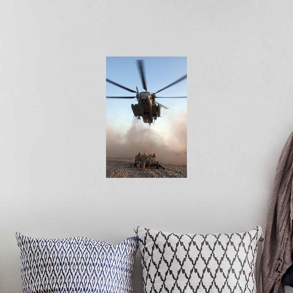 A bohemian room featuring US Marines attach an M777A2 Lightweight Howitzer to a CH53E Super Stallion helicopter