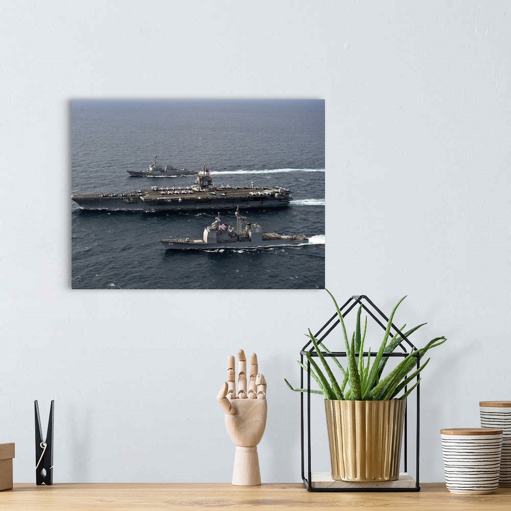 A bohemian room featuring U.S. Navy ships transit the Atlantic Ocean.