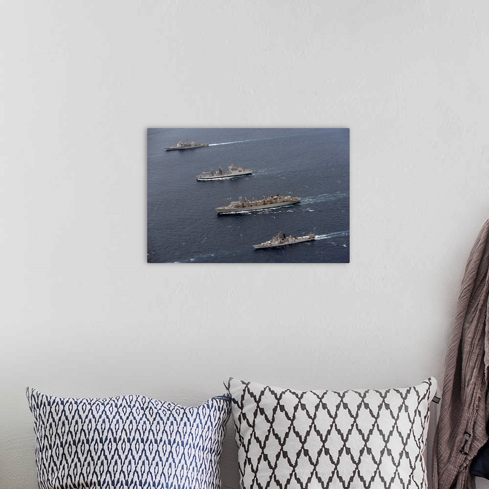 A bohemian room featuring USS Bunker Hill, INS Shakti, USNS Bridge and INS Ranvir transit in formation.