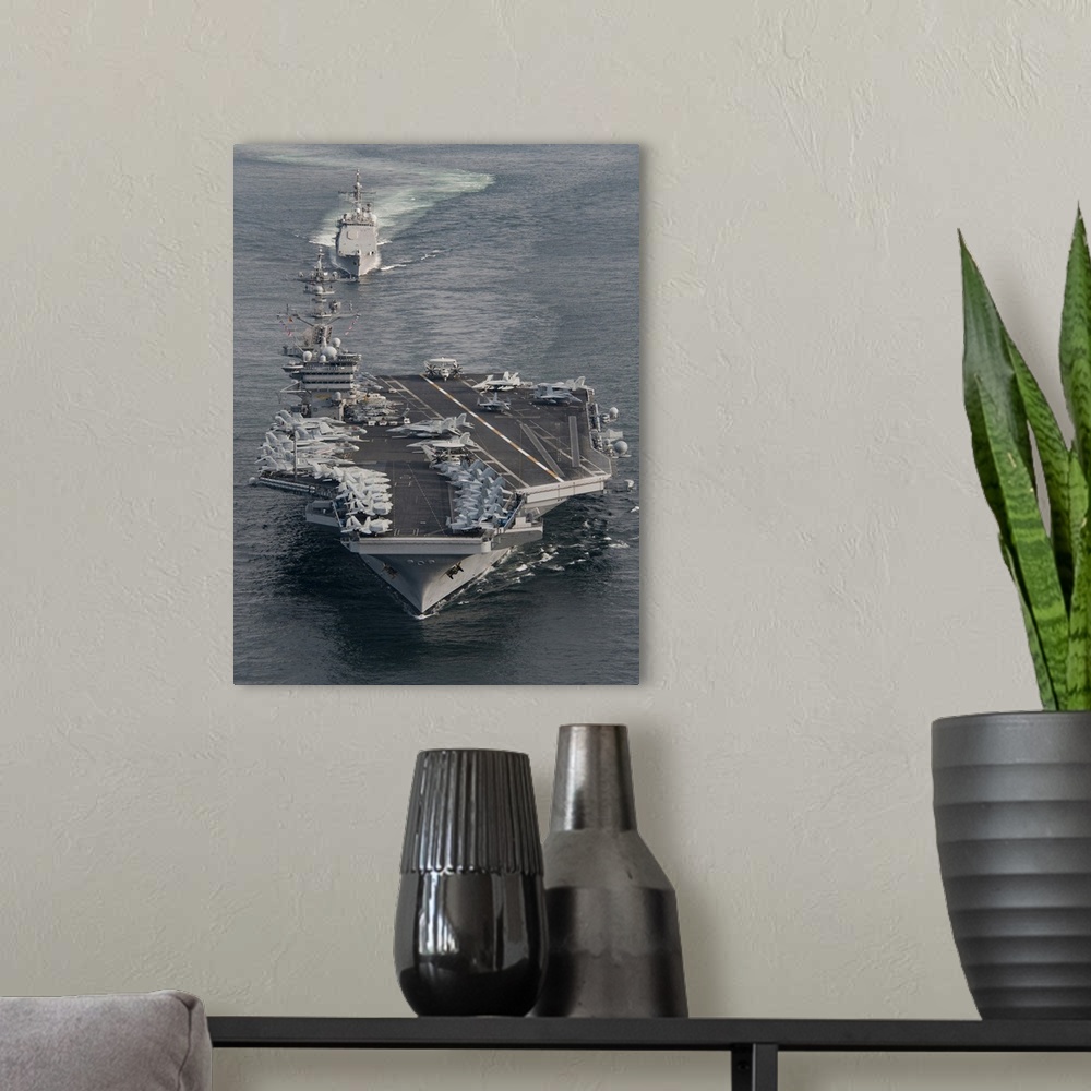 A modern room featuring USS Carl Vinson and USS Bunker Hill transit the Strait of Malacca.