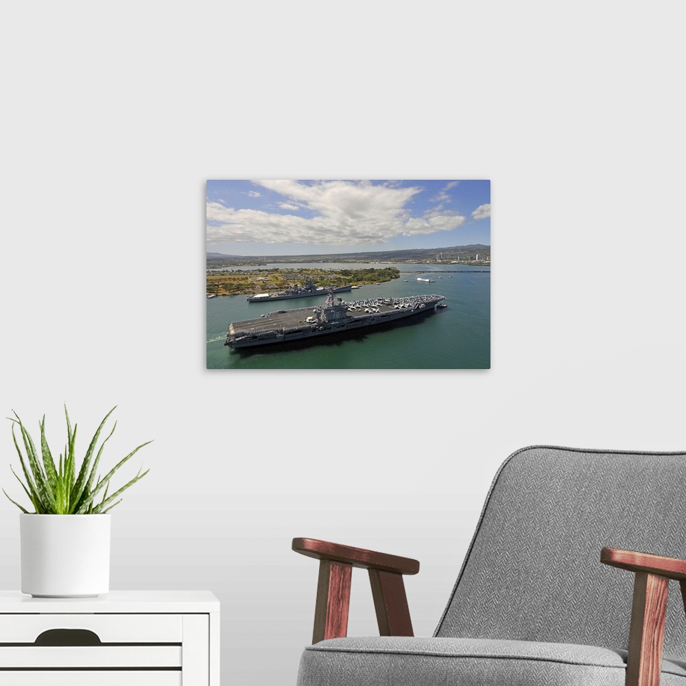 A modern room featuring USS Carl Vinson passes the USS Missouri Memorial in Pearl Harbor.