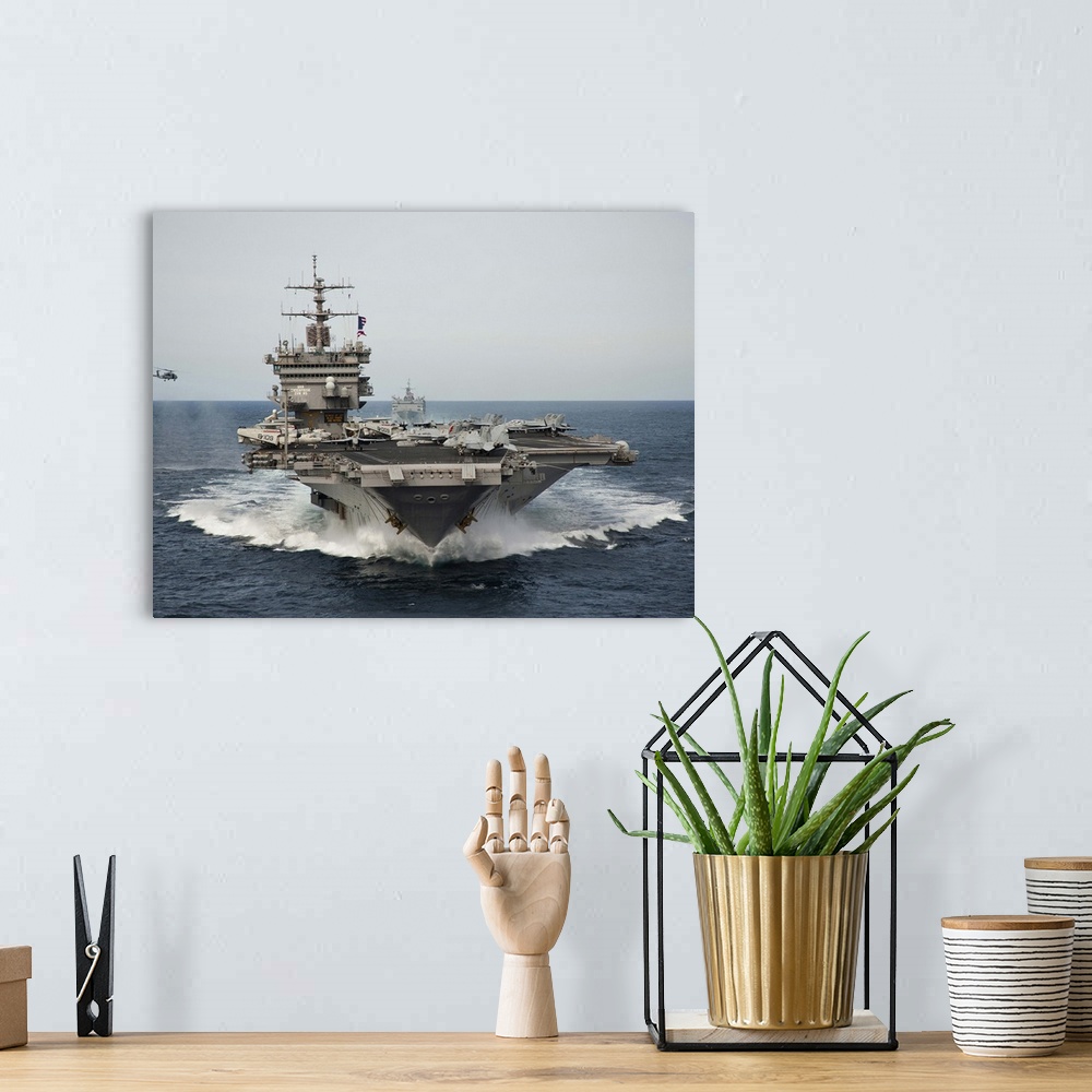 A bohemian room featuring USS Enterprise transits the Atlantic Ocean.