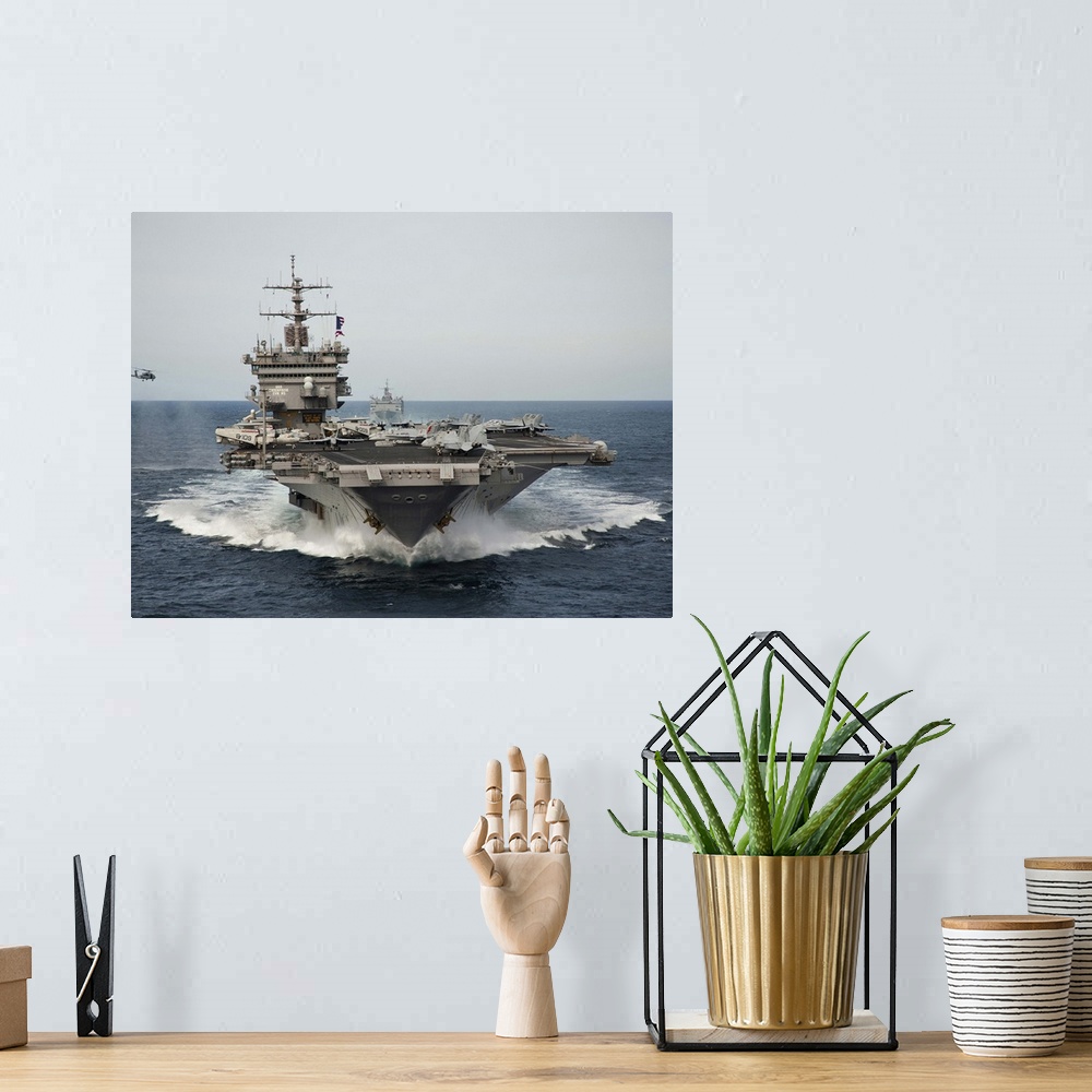 A bohemian room featuring USS Enterprise transits the Atlantic Ocean.