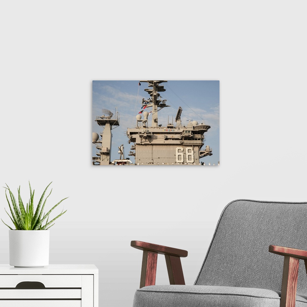 A modern room featuring Pearl Harbor, December 3 2013 - The aircraft carrier USS Nimitz (CVN 68) arrives at Joint Base Pe...