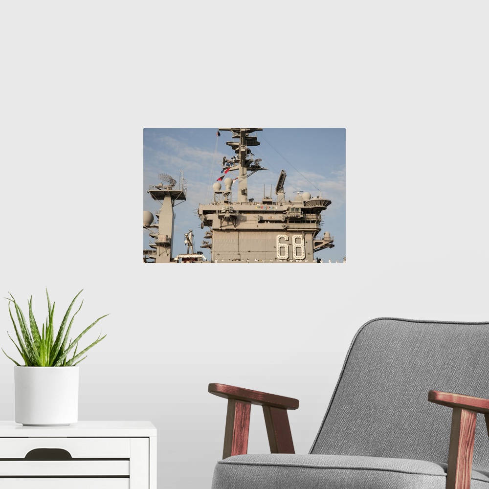 A modern room featuring Pearl Harbor, December 3 2013 - The aircraft carrier USS Nimitz (CVN 68) arrives at Joint Base Pe...