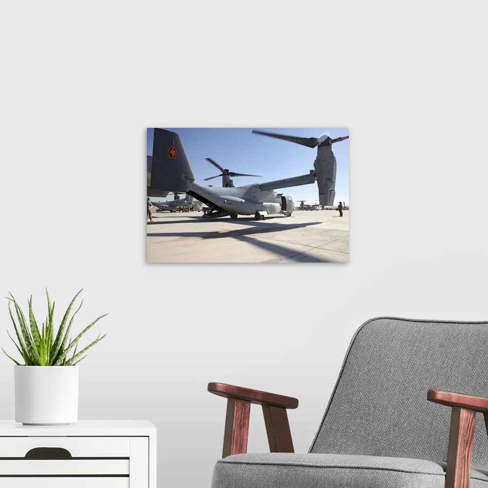 A modern room featuring January 15, 2011 - V-22 Osprey tiltrotor aircraft arrive at Camp Bastion, Afghanistan as an augme...