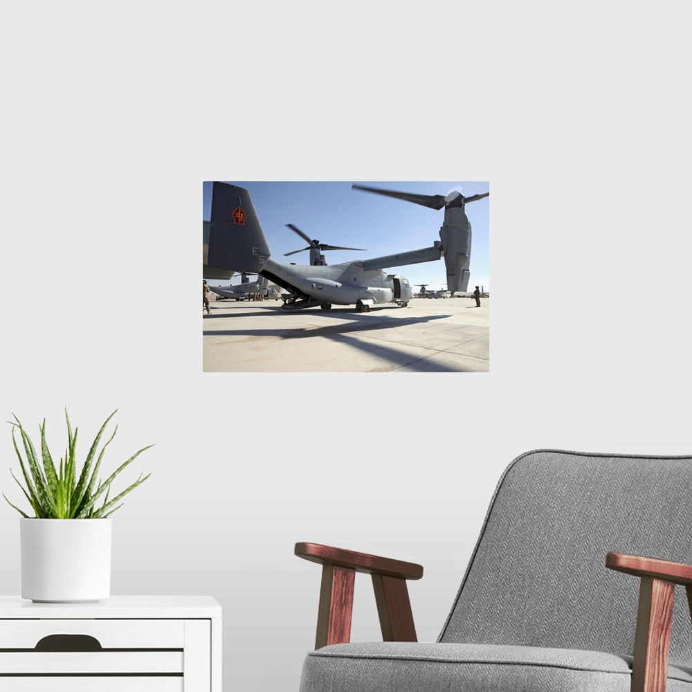 A modern room featuring January 15, 2011 - V-22 Osprey tiltrotor aircraft arrive at Camp Bastion, Afghanistan as an augme...