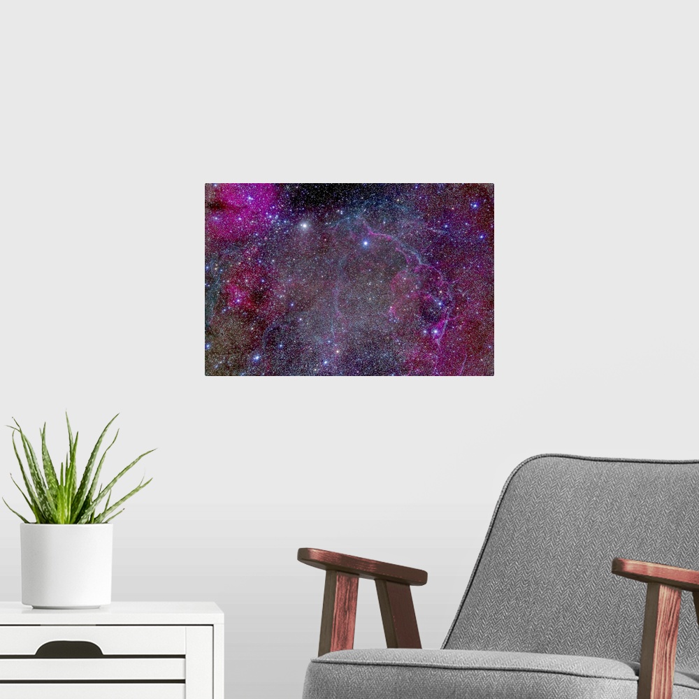 A modern room featuring The Vela supernova remnant in the centre of the Gum Nebula area of Vela. This is the remains of a...