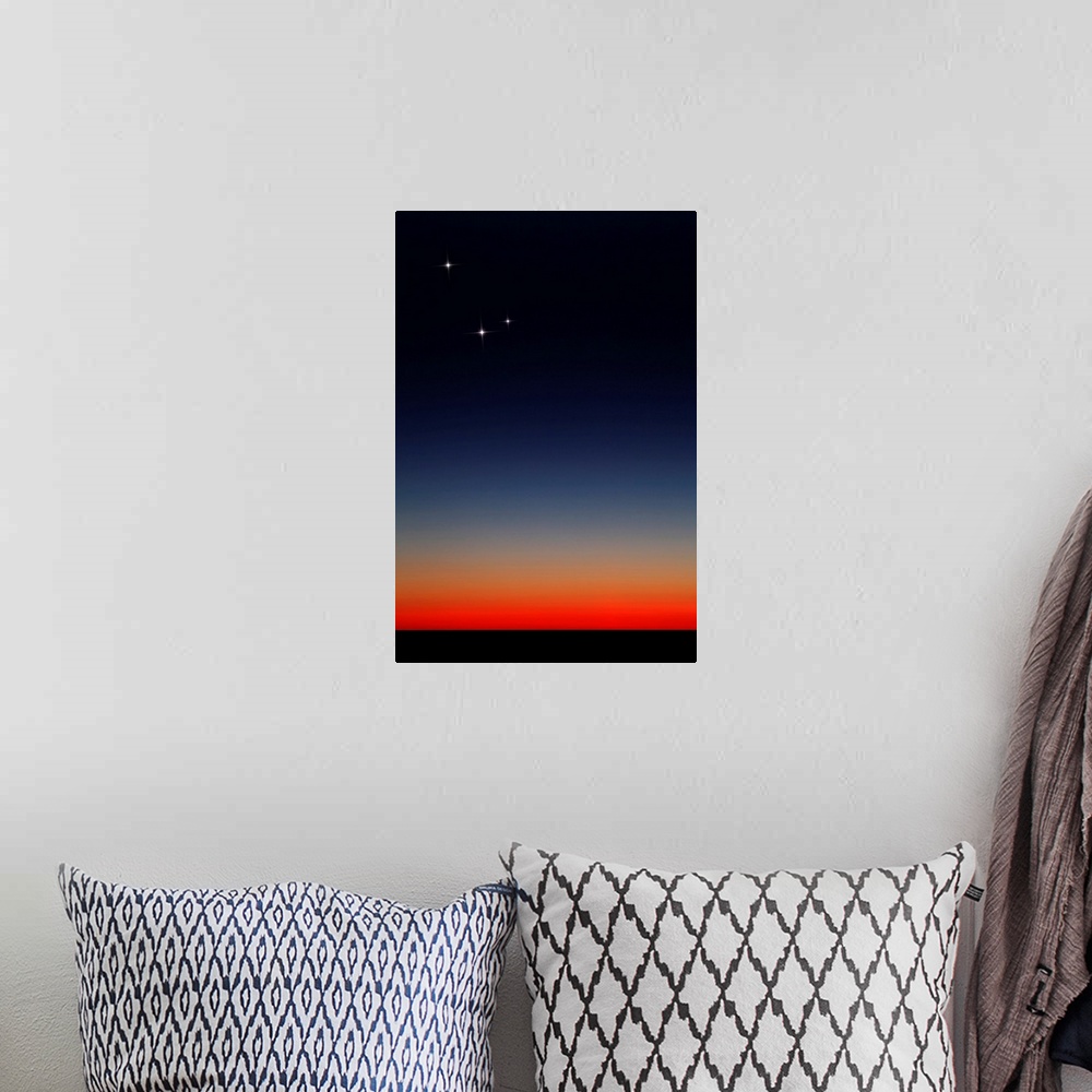 A bohemian room featuring Venus, Mercury and Mars above the glowing horizon at dawn.