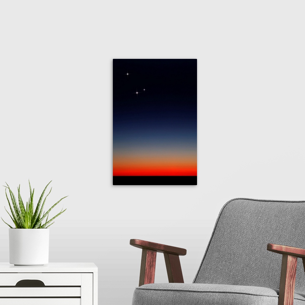 A modern room featuring Venus, Mercury and Mars above the glowing horizon at dawn.