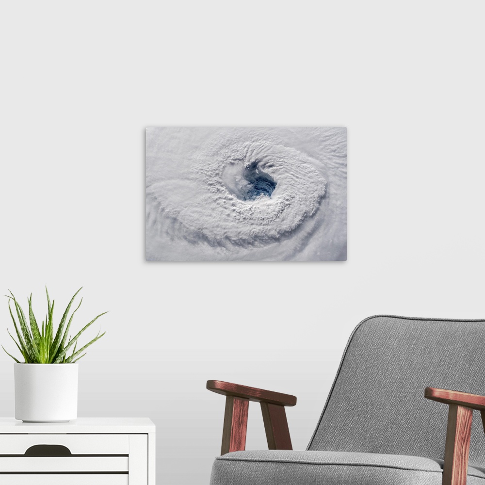 A modern room featuring View from space showing the eye of Hurricane Florence in the Atlantic Ocean.